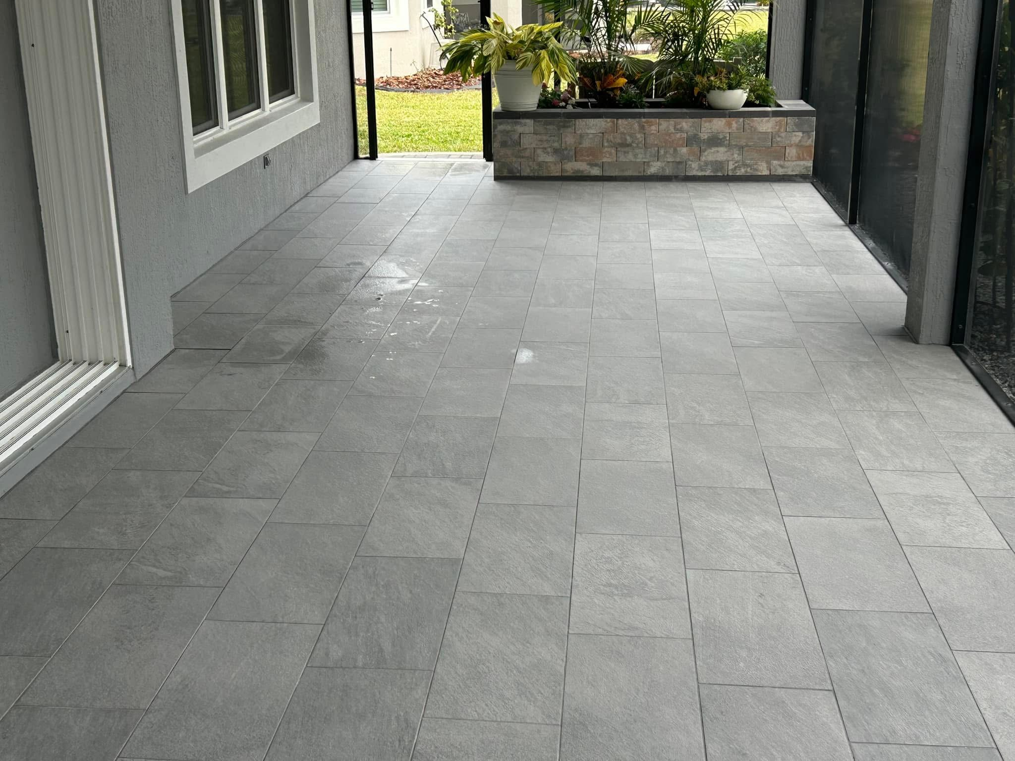 Enhance your outdoor living experience with uniform, low-maintenance porcelain stone tiles that pair beautifully with modern stucco finishes.