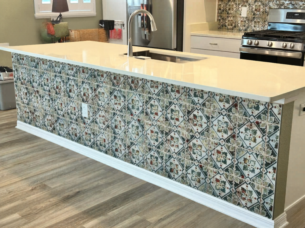 Custom decorative tile installation brings old-world charm, rich color, and unique personality to a modern white kitchen island base.