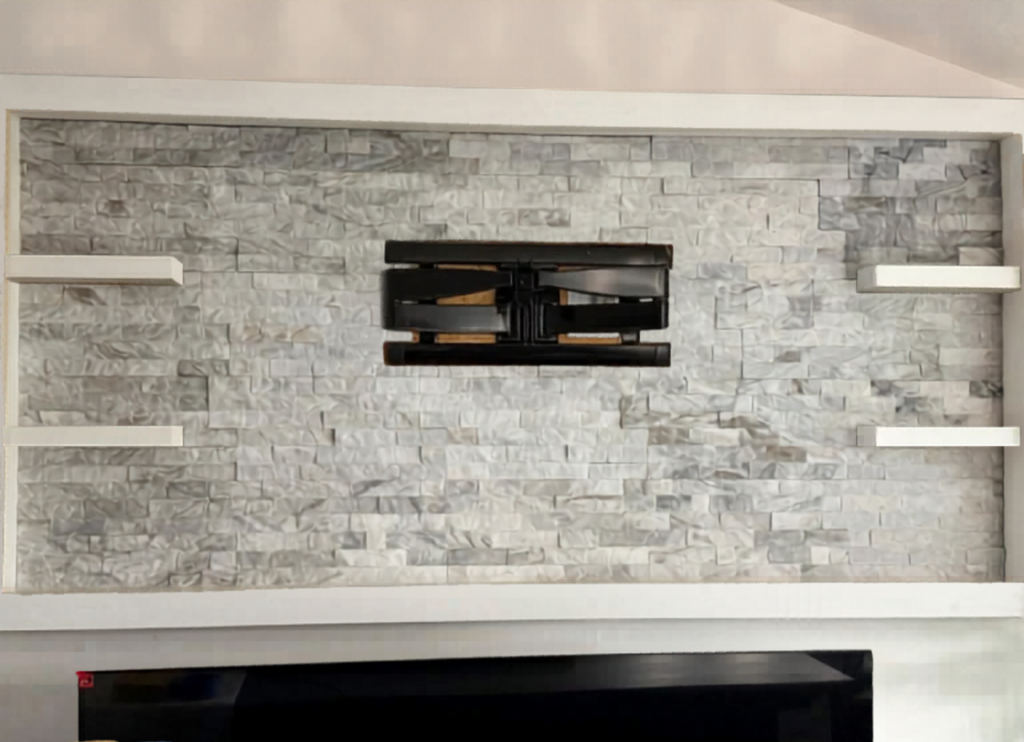 Transform your living room with a custom stone fireplace surround, featuring precision integrated shelving and a built-in media mount.